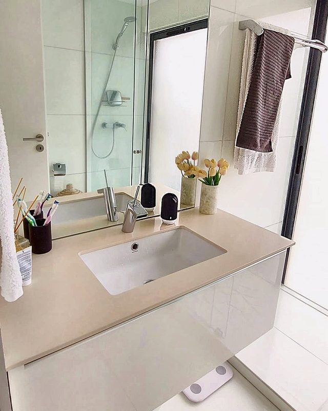 The bathroom Room B and Room C share, with a glass shower, washbasin and window